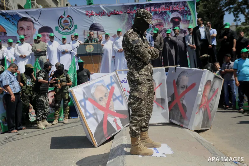 Palestinian supporters of the Islamist movement Hamas take part during a rally to commemorate the 68th anniversary of the "Nakba" or "catastrophe" in Arabic in reference to the establishment in 1948 of the state of Israe...