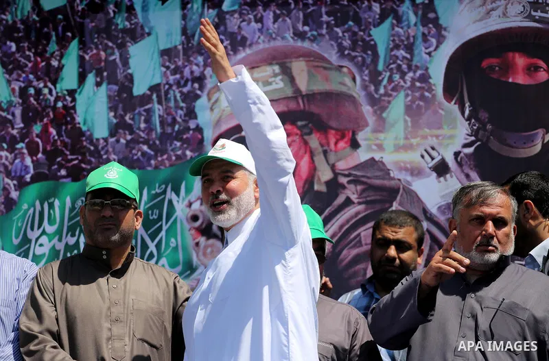 The head of the Islamist Palestinian movement Hamas, Ismail Haniya, takes part during a rally to commemorate the 68th anniversary of the "Nakba" or "catastrophe" in Arabic in reference to the establishment in 1948 of the...