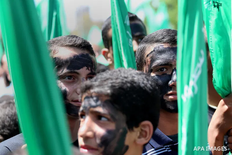 Palestinian supporters of the Islamist movement Hamas take part during a rally to commemorate the 68th anniversary of the "Nakba" or "catastrophe" in Arabic in reference to the establishment in 1948 of the state of Israe...