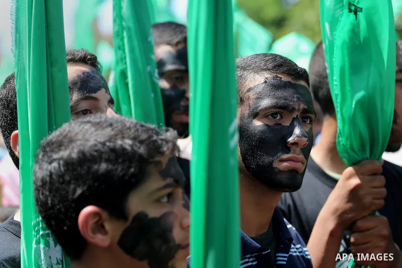 Palestinian supporters of the Islamist movement Hamas take part during a rally to commemorate the 68th anniversary of the "Nakba" or "catastrophe" in Arabic in reference to the establishment in 1948 of the state of Israe...