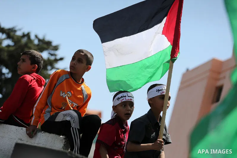 Palestinian supporters of the Islamist movement Hamas take part during a rally to commemorate the 68th anniversary of the "Nakba" or "catastrophe" in Arabic in reference to the establishment in 1948 of the state of Israe...