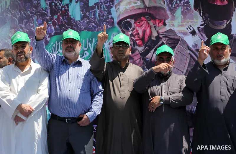 Palestinian supporters of the Islamist movement Hamas take part during a rally to commemorate the 68th anniversary of the "Nakba" or "catastrophe" in Arabic in reference to the establishment in 1948 of the state of Israe...