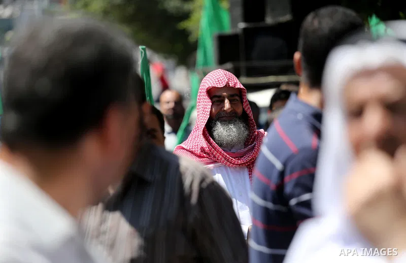 Palestinian supporters of the Islamist movement Hamas take part during a rally to commemorate the 68th anniversary of the "Nakba" or "catastrophe" in Arabic in reference to the establishment in 1948 of the state of Israe...