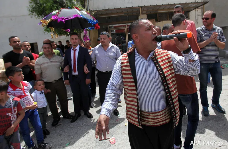 Palestinian friends and relatives celebrated the groom, Mahran Abu Rish, in the West Bank city of Nablus on the eve of his wedding on May 21, 2016, during the traditional celebration, Abu Rish, was first taken by relativ...