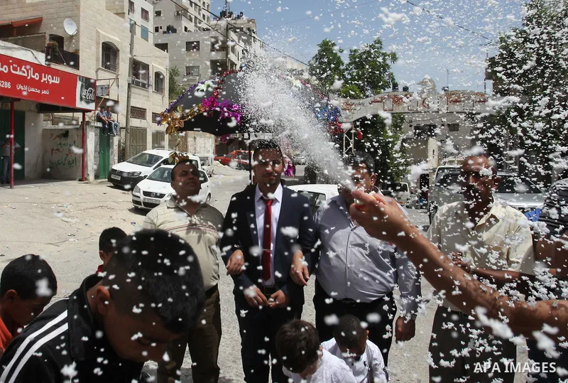 Palestinian friends and relatives celebrated the groom, Mahran Abu Rish, in the West Bank city of Nablus on the eve of his wedding on May 21, 2016, during the traditional celebration, Abu Rish, was first taken by relativ...