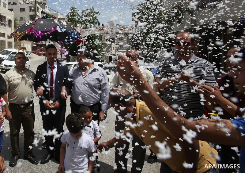 Palestinian friends and relatives celebrated the groom, Mahran Abu Rish, in the West Bank city of Nablus on the eve of his wedding on May 21, 2016, during the traditional celebration, Abu Rish, was first taken by relativ...