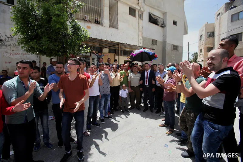 Palestinian friends and relatives celebrated the groom, Mahran Abu Rish, in the West Bank city of Nablus on the eve of his wedding on May 21, 2016, during the traditional celebration, Abu Rish, was first taken by relativ...