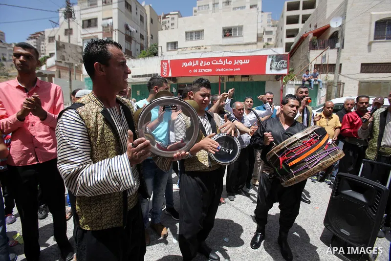 Palestinian friends and relatives celebrated the groom, Mahran Abu Rish, in the West Bank city of Nablus on the eve of his wedding on May 21, 2016, during the traditional celebration, Abu Rish, was first taken by relativ...