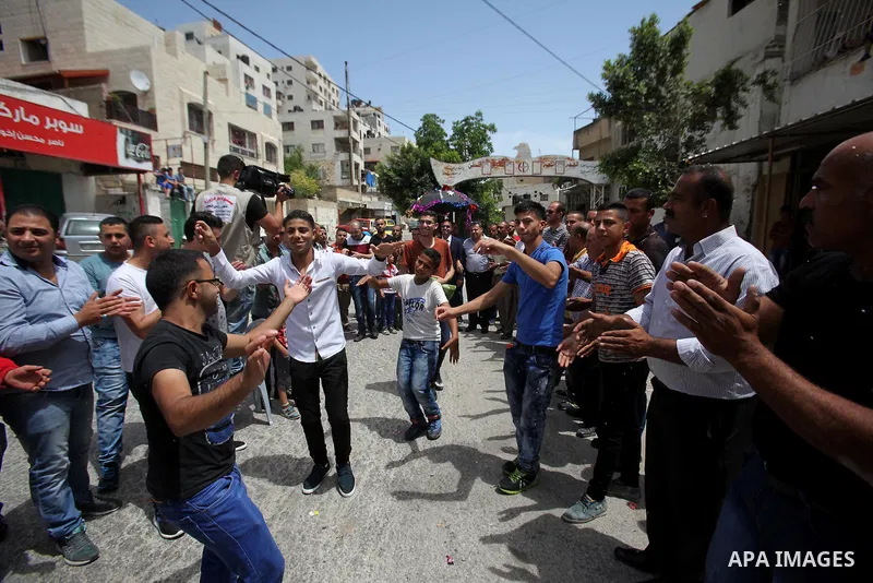 Palestinian friends and relatives celebrated the groom, Mahran Abu Rish, in the West Bank city of Nablus on the eve of his wedding on May 21, 2016, during the traditional celebration, Abu Rish, was first taken by relativ...