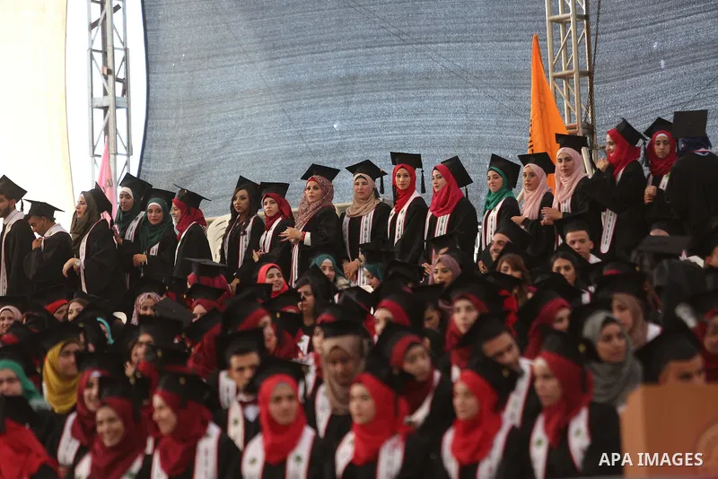 Palestinian students attend their graduation ceremony at the end of the academic year on May 21, 2016 at Birzeit University in the West Bank town of Birzeit, near Ramallah. Photo by Shadi Hatem