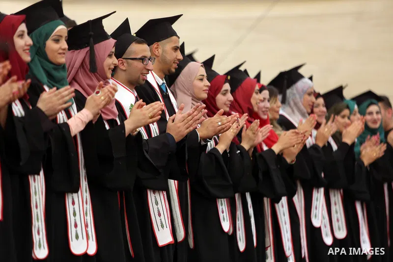 Palestinian students attend their graduation ceremony at the end of the academic year on May 21, 2016 at Birzeit University in the West Bank town of Birzeit, near Ramallah. Photo by Shadi Hatem