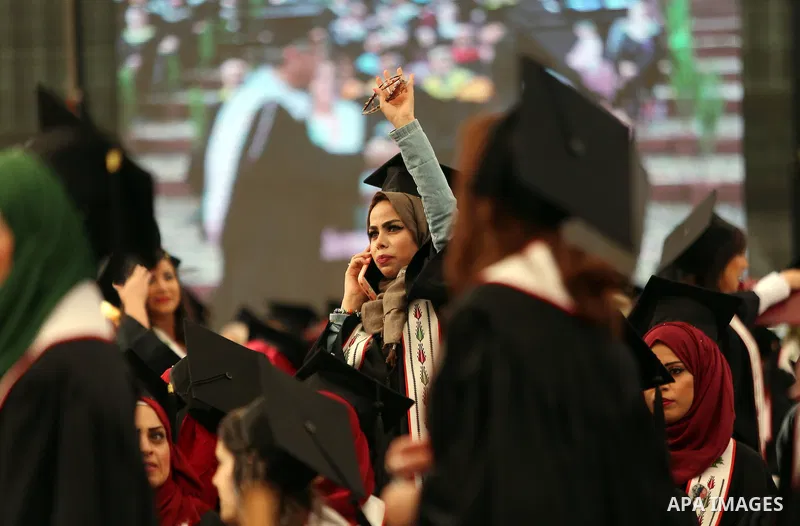 Palestinian students attend their graduation ceremony at the end of the academic year on May 21, 2016 at Birzeit University in the West Bank town of Birzeit, near Ramallah. Photo by Shadi Hatem