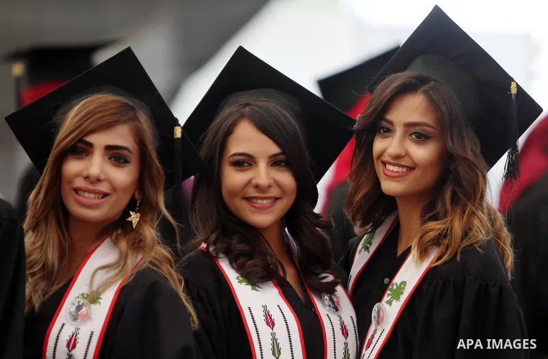 Palestinian students attend their graduation ceremony at the end of the academic year on May 21, 2016 at Birzeit University in the West Bank town of Birzeit, near Ramallah. Photo by Shadi Hatem