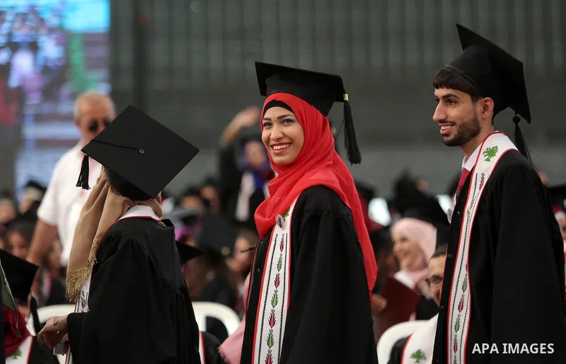 Palestinian students attend their graduation ceremony at the end of the academic year on May 21, 2016 at Birzeit University in the West Bank town of Birzeit, near Ramallah. Photo by Shadi Hatem