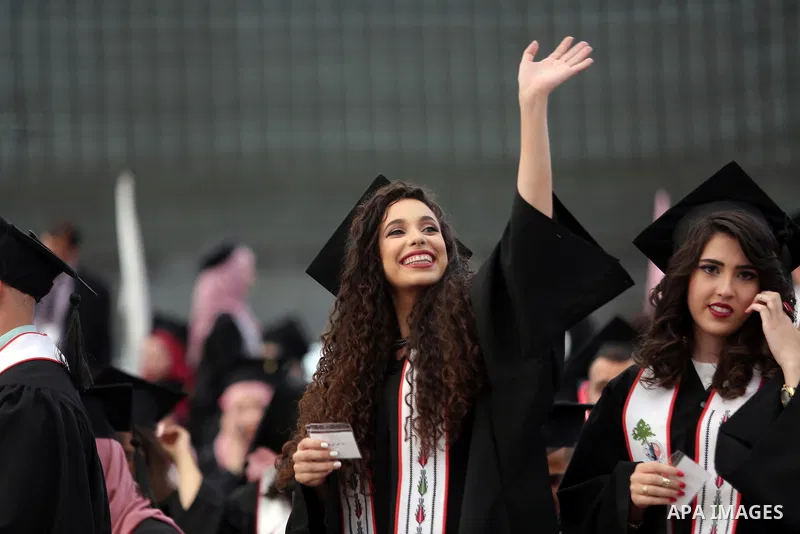 Palestinian students attend their graduation ceremony at the end of the academic year on May 21, 2016 at Birzeit University in the West Bank town of Birzeit, near Ramallah. Photo by Shadi Hatem