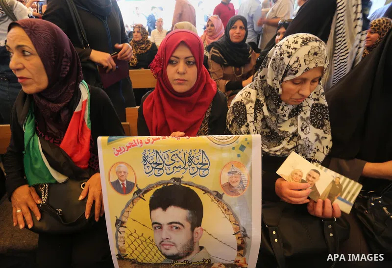 Palestinians take part in a protest demanding release the prisoners in Israeli jails, in front of Red cross office, in Gaza city, on May 23, 2016. Photo by Mohammed Asad