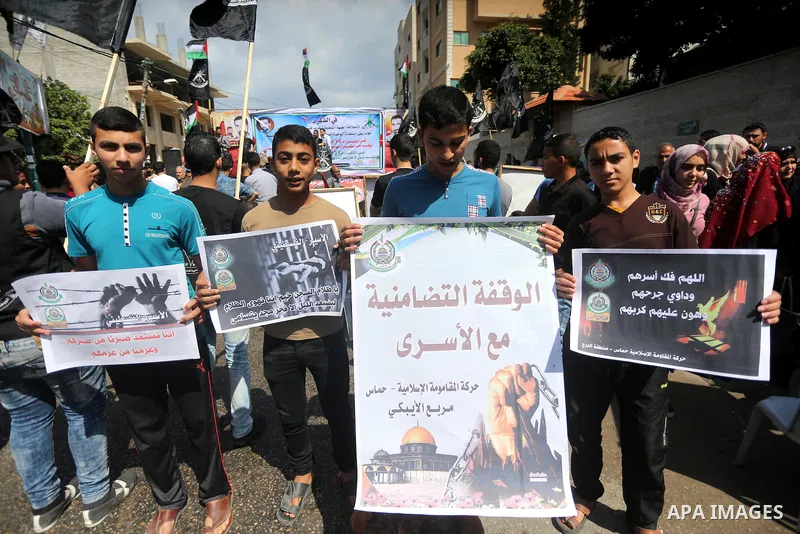 Palestinians gather during a rally marking the 51th anniversary of the Popular Front for the Liberation of Palestine (General Command),in front of Red cross office, in Gaza city, on May 23, 2016. Photo by Mohammed Asad