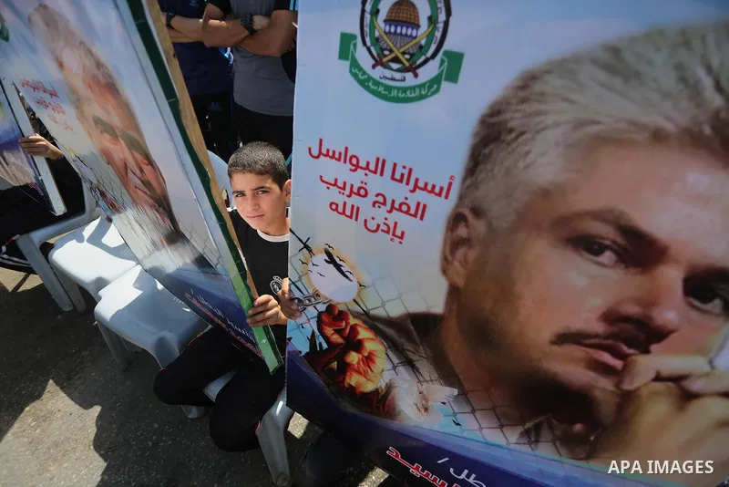 Palestinians gather during a rally marking the 51th anniversary of the Popular Front for the Liberation of Palestine (General Command),in front of Red cross office, in Gaza city, on May 23, 2016. Photo by Mohammed Asad
