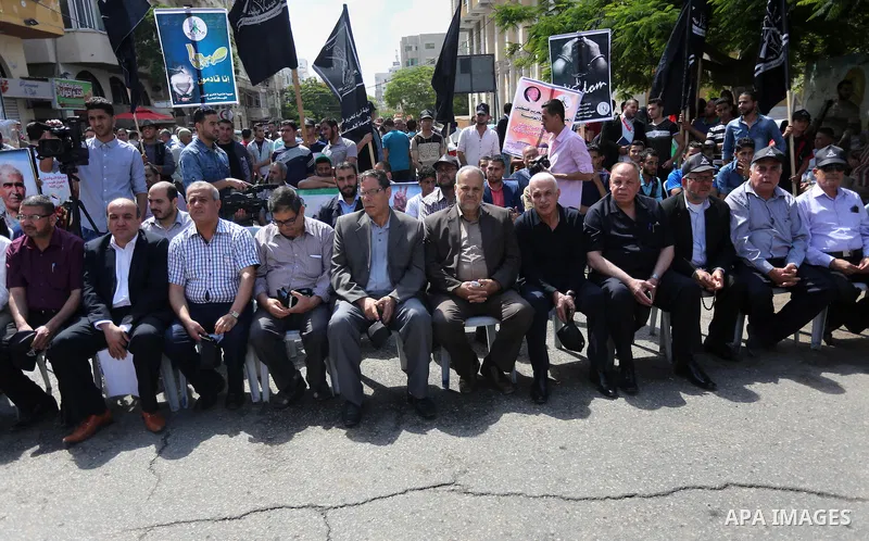 Palestinians gather during a rally marking the 51th anniversary of the Popular Front for the Liberation of Palestine (General Command),in front of Red cross office, in Gaza city, on May 23, 2016. Photo by Mohammed Asad