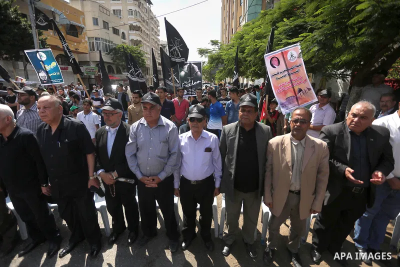 Palestinians gather during a rally marking the 51th anniversary of the Popular Front for the Liberation of Palestine (General Command),in front of Red cross office, in Gaza city, on May 23, 2016. Photo by Mohammed Asad