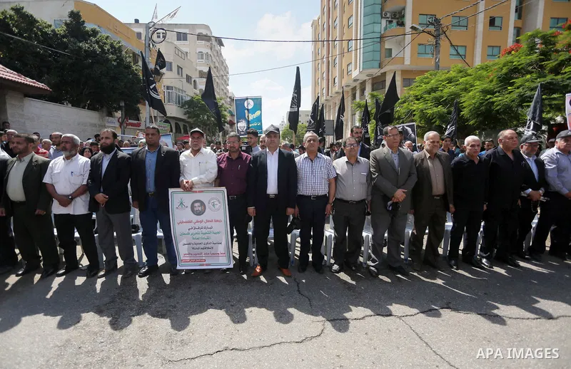 Palestinians gather during a rally marking the 51th anniversary of the Popular Front for the Liberation of Palestine (General Command),in front of Red cross office, in Gaza city, on May 23, 2016. Photo by Mohammed Asad