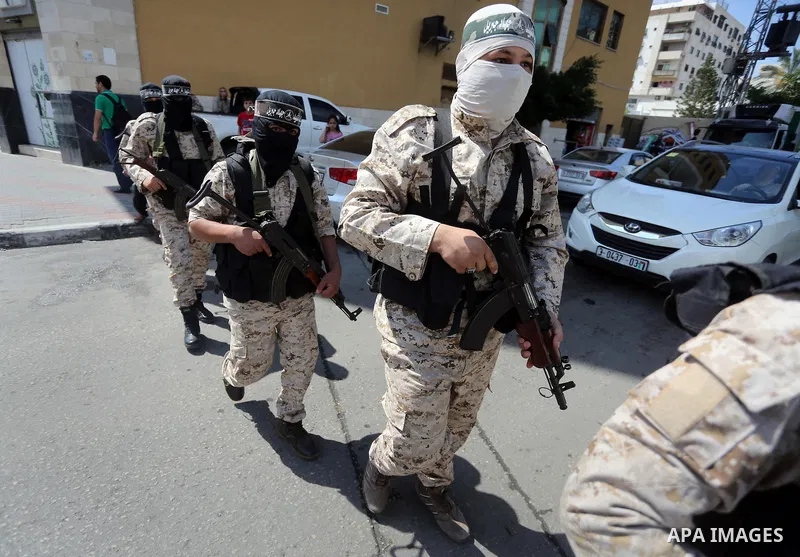 Masked Palestinian take part in a rally marking the 51th anniversary of the Popular Front for the Liberation of Palestine (General Command),in front of Red cross office, in Gaza city, on May 23, 2016. Photo by Mohammed A...