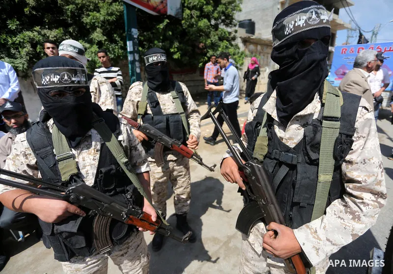 Masked Palestinian take part in a rally marking the 51th anniversary of the Popular Front for the Liberation of Palestine (General Command),in front of Red cross office, in Gaza city, on May 23, 2016. Photo by Mohammed A...
