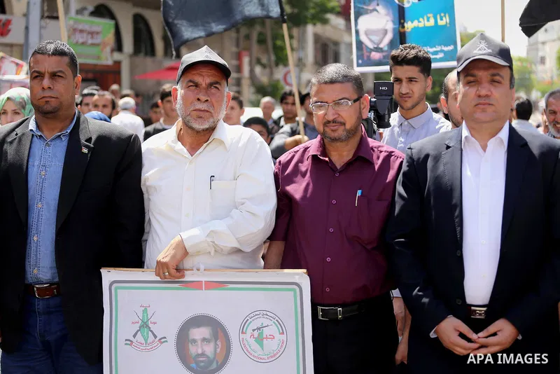 Palestinians gather during a rally marking the 51th anniversary of the Popular Front for the Liberation of Palestine (General Command),in front of Red cross office, in Gaza city, on May 23, 2016. Photo by Mohammed Asad