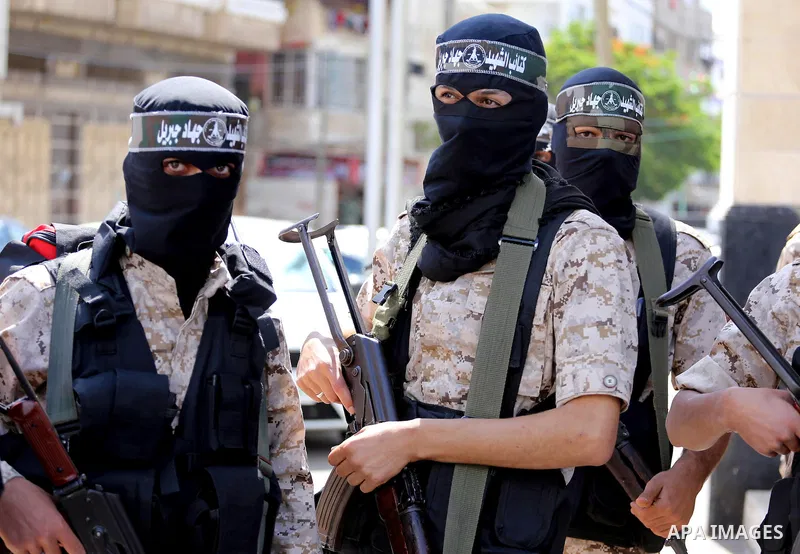 Masked Palestinian take part in a rally marking the 51th anniversary of the Popular Front for the Liberation of Palestine (General Command),in front of Red cross office, in Gaza city, on May 23, 2016. Photo by Mohammed A...