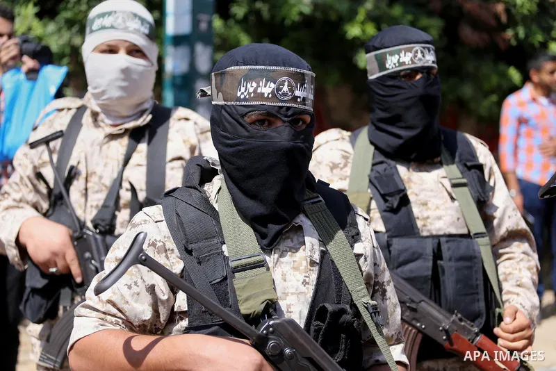 Masked Palestinian take part in a rally marking the 51th anniversary of the Popular Front for the Liberation of Palestine (General Command),in front of Red cross office, in Gaza city, on May 23, 2016. Photo by Mohammed A...