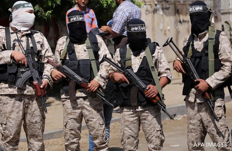 Masked Palestinian take part in a rally marking the 51th anniversary of the Popular Front for the Liberation of Palestine (General Command),in front of Red cross office, in Gaza city, on May 23, 2016. Photo by Mohammed A...