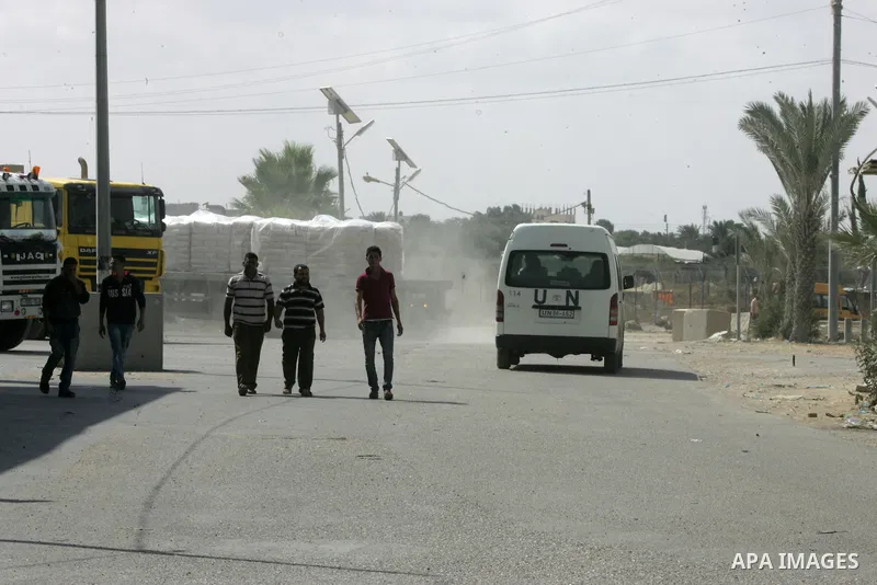 Loaded trucks cross the Kerem Shalom crossing to Rafah in southern Gaza Strip on May 23, 2016. Israel said on May 22 it was lifting a ban imposed last month on private imports of cement to the Hamas-run Gaza Strip. The b...