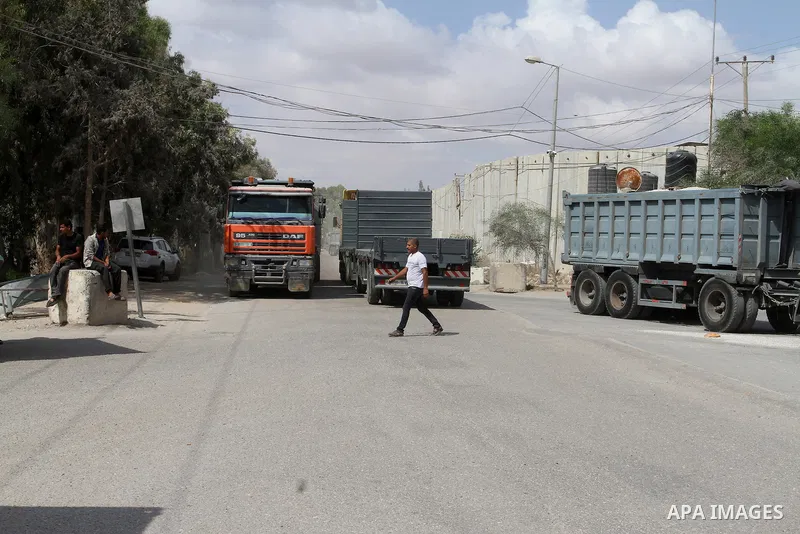 Loaded trucks cross the Kerem Shalom crossing to Rafah in southern Gaza Strip on May 23, 2016. Israel said on May 22 it was lifting a ban imposed last month on private imports of cement to the Hamas-run Gaza Strip. The b...