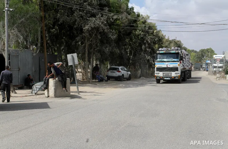 Loaded trucks cross the Kerem Shalom crossing to Rafah in southern Gaza Strip on May 23, 2016. Israel said on May 22 it was lifting a ban imposed last month on private imports of cement to the Hamas-run Gaza Strip. The b...