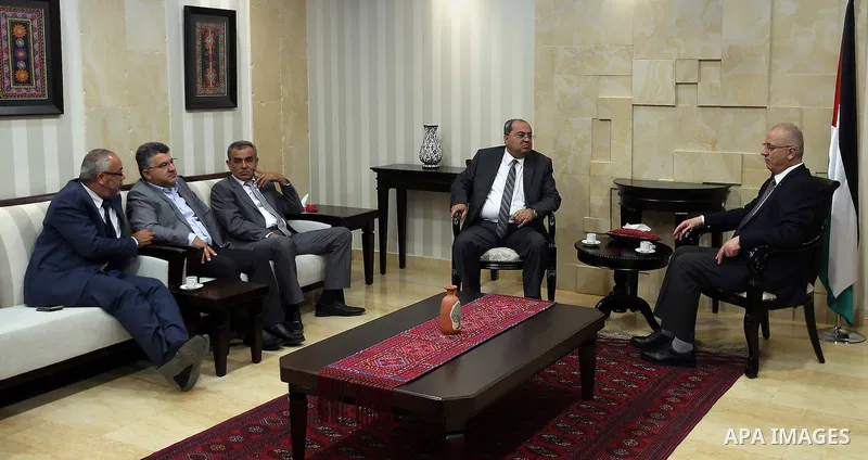 Palestinian Prime Minister, Rami Hamdallah, meets with Arab-Israeli Knesset member,Ahmad al-Tib, in the West Bank city of Ramallah, on May 23, 2016. Photo by Prime Minister Office