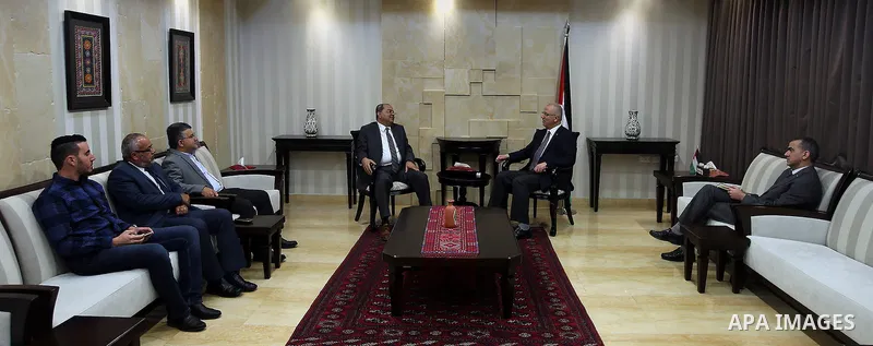 Palestinian Prime Minister, Rami Hamdallah, meets with Arab-Israeli Knesset member,Ahmad al-Tib, in the West Bank city of Ramallah, on May 23, 2016. Photo by Prime Minister Office