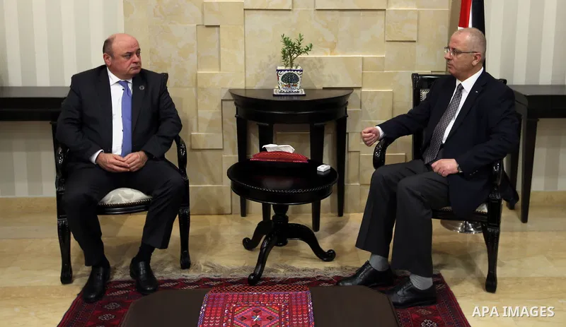 Palestinian Prime Minister Rami Hamdallah meets with Azzam Shawwa Governor of the Palestinian Monetary Authority in the West Bank city of Ramallah, on May 23, 2016. Photo by Prime Minister Office