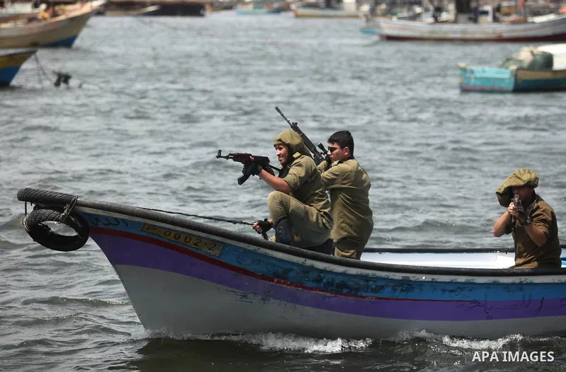 Palestinians take part in a protest against the Israeli blockade of the Gaza Strip at the Gaza seaport, on May 24, 2016. Photo by Ashraf Amra