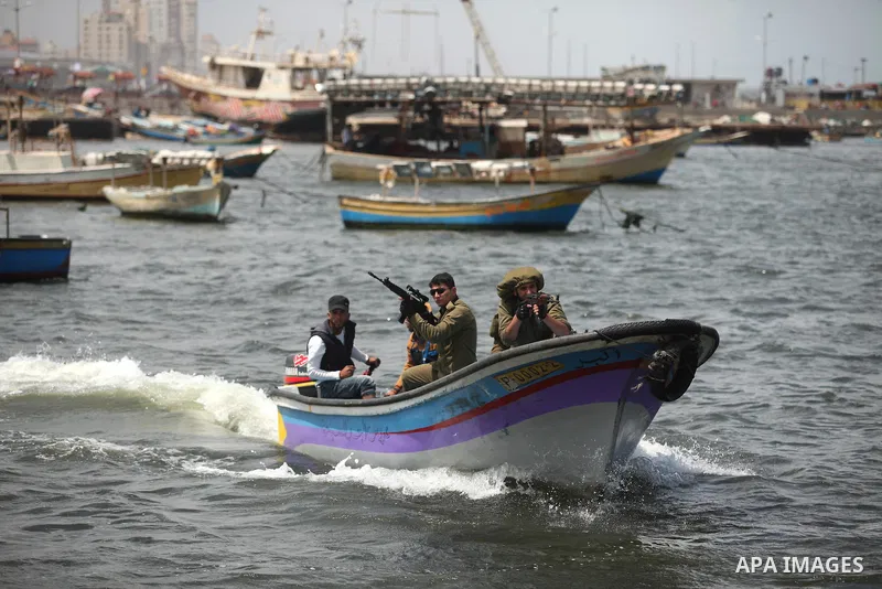 Palestinians take part in a protest against the Israeli blockade of the Gaza Strip at the Gaza seaport, on May 24, 2016. Photo by Ashraf Amra