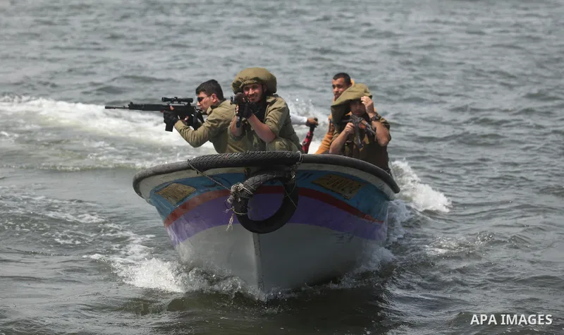 Palestinians take part in a protest against the Israeli blockade of the Gaza Strip at the Gaza seaport, on May 24, 2016. Photo by Ashraf Amra