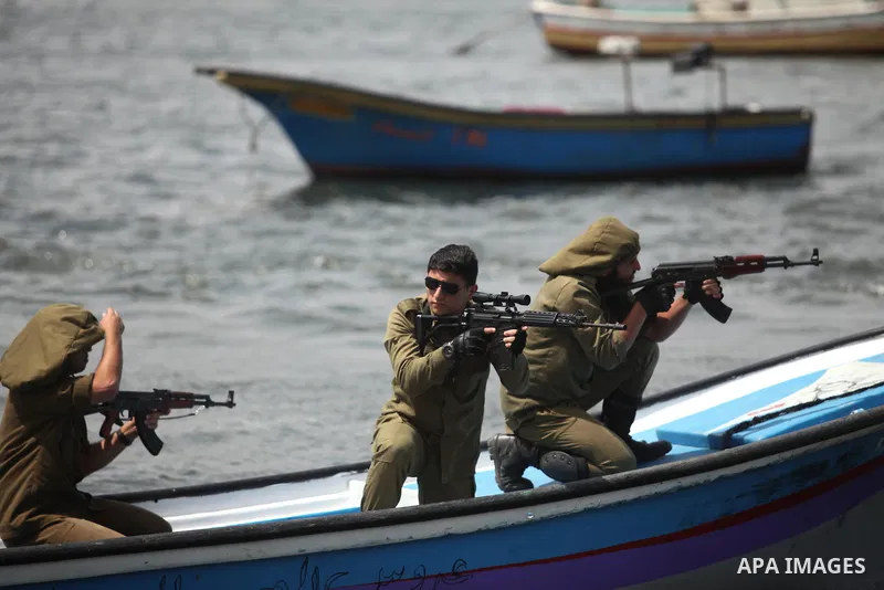 Palestinians take part in a protest against the Israeli blockade of the Gaza Strip at the Gaza seaport, on May 24, 2016. Photo by Ashraf Amra