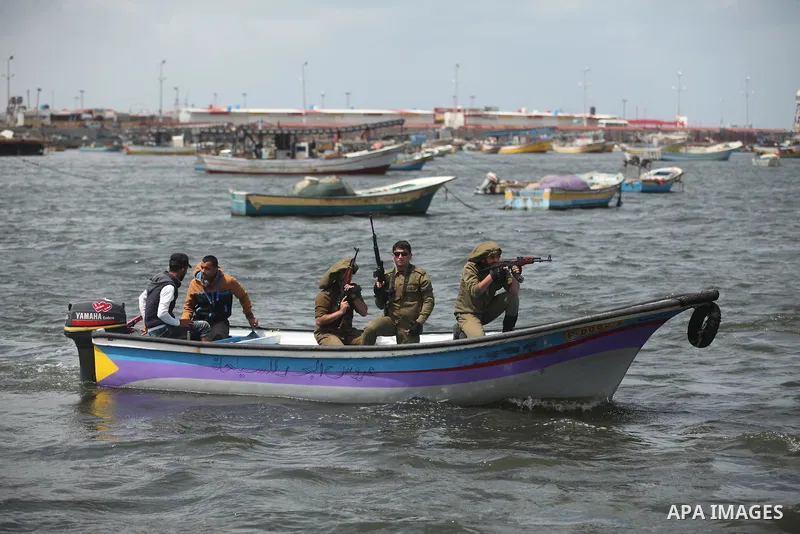 Palestinians take part in a protest against the Israeli blockade of the Gaza Strip at the Gaza seaport, on May 24, 2016. Photo by Ashraf Amra