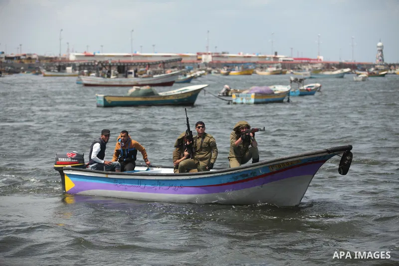 Palestinians take part in a protest against the Israeli blockade of the Gaza Strip at the Gaza seaport, on May 24, 2016. Photo by Ashraf Amra