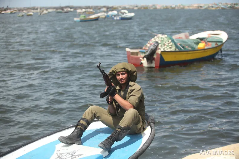Palestinians take part in a protest against the Israeli blockade of the Gaza Strip at the Gaza seaport, on May 24, 2016. Photo by Ashraf Amra
