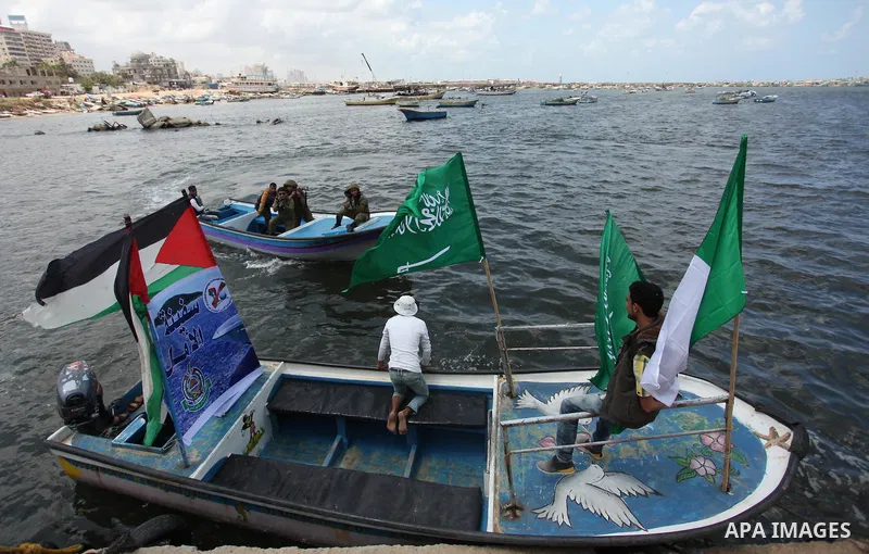 Palestinians take part in a protest against the Israeli blockade of the Gaza Strip at the Gaza seaport, on May 24, 2016. Photo by Ashraf Amra