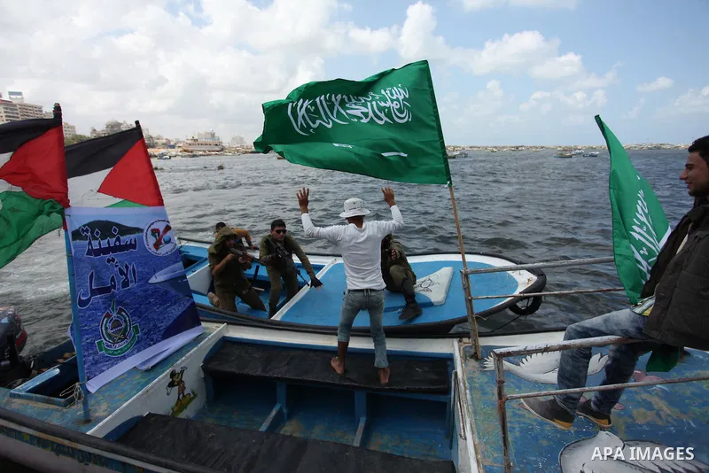 Palestinians take part in a protest against the Israeli blockade of the Gaza Strip at the Gaza seaport, on May 24, 2016. Photo by Ashraf Amra