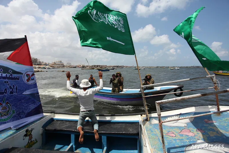 Palestinians take part in a protest against the Israeli blockade of the Gaza Strip at the Gaza seaport, on May 24, 2016. Photo by Ashraf Amra