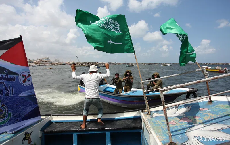 Palestinians take part in a protest against the Israeli blockade of the Gaza Strip at the Gaza seaport, on May 24, 2016. Photo by Ashraf Amra