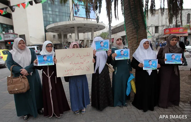 Palestinian journalists take part in a protest demanding the released for their colleague, Tareq Abu Zaid, the Journalist of Al-Aqsa TV, detained by Palestinian Authority, in the West bank city of Nablus, on May 24, 2016...