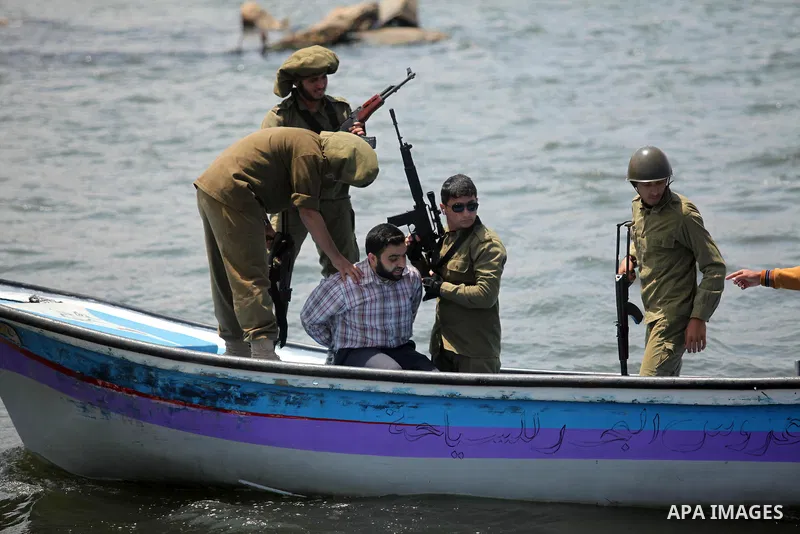 Palestinians take part in a protest against the Israeli blockade of the Gaza Strip at the Gaza seaport, on May 24, 2016. Photo by Ashraf Amra